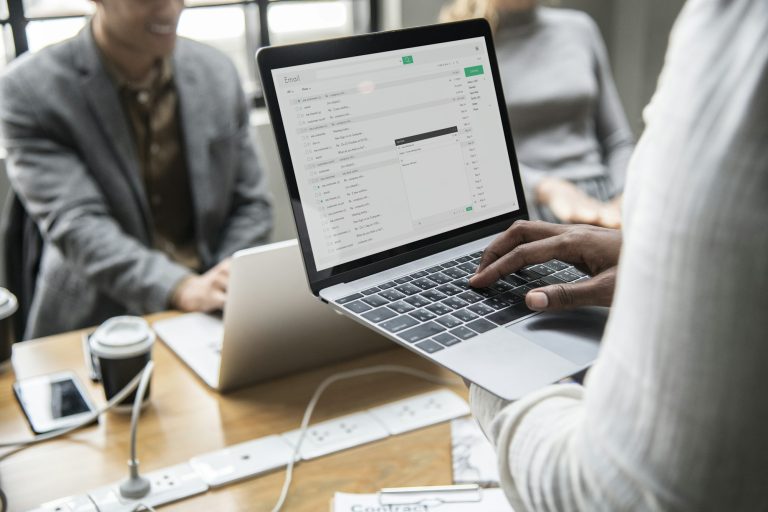 Man checking his email on a laptop